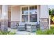 Inviting front porch with stone accents and comfortable seating at 1880 Woodall Crest Dr, Apex, NC 27502