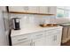 Bright kitchen featuring white cabinets, subway tile backsplash, and modern countertops, providing a clean and stylish cooking space at 1880 Woodall Crest Dr, Apex, NC 27502