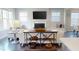 Cozy living room with a fireplace, comfortable seating, and stylish decor, creating a welcoming and inviting atmosphere at 1880 Woodall Crest Dr, Apex, NC 27502