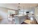 Spacious living area featuring an island, seamlessly connecting the kitchen, dining, and living spaces for modern living at 1880 Woodall Crest Dr, Apex, NC 27502