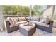 Plush outdoor sectional perfect for relaxing on this screened porch at 1880 Woodall Crest Dr, Apex, NC 27502