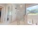 A large glass shower features beautiful tile work, with a luxurious soaking tub nearby at 1880 Woodall Crest Dr, Apex, NC 27502