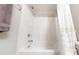 Clean white shower tub combo featuring chrome fixtures and towel bar at 1880 Woodall Crest Dr, Apex, NC 27502