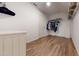 Spacious walk-in closet with wood flooring and wire shelving for organized storage at 1880 Woodall Crest Dr, Apex, NC 27502