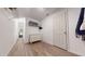 Walk-in closet featuring wood flooring, wire shelves and a dresser for extra storage at 1880 Woodall Crest Dr, Apex, NC 27502