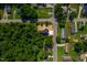 An aerial view of a cozy single-Gathering home featuring a concrete driveway and lush green surroundings at 205 Gentry St, Roxboro, NC 27573