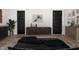 Staged bedroom showcases modern decor and black doors that contrast the hardwood floors at 205 Gentry St, Roxboro, NC 27573