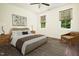Comfortable bedroom with a ceiling fan, stylish furniture, and a cozy aesthetic at 205 Gentry St, Roxboro, NC 27573