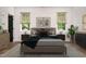 Staged bedroom exhibiting natural light, with an earthy aesthetic at 205 Gentry St, Roxboro, NC 27573