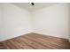 Bedroom featuring neutral walls, hardwood flooring and ample light from the window at 205 Gentry St, Roxboro, NC 27573