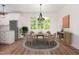 Cozy dining area featuring a round table, comfortable chairs, and a view of the backyard at 205 Gentry St, Roxboro, NC 27573