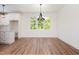 Bright dining area with a large window, modern light fixture, and lots of space at 205 Gentry St, Roxboro, NC 27573