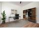 Contemporary home office featuring modern desk, shelving, and decor for productive workspace at 205 Gentry St, Roxboro, NC 27573