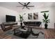 An inviting living room features modern furniture, sleek wood flooring, and neutral walls at 205 Gentry St, Roxboro, NC 27573