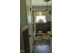 Neutral toned bathroom features a shower-tub, a window, and a stool at 2306 Cool Springs Rd, Sanford, NC 27330