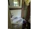 Quaint bathroom with vintage sink, mirror and wood trim at 2306 Cool Springs Rd, Sanford, NC 27330