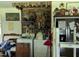 Well organized laundry room with white washer and dryer set, shelves, and rustic wood decor at 2306 Cool Springs Rd, Sanford, NC 27330