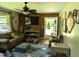 Cozy living room with plenty of natural light and a ceiling fan at 2306 Cool Springs Rd, Sanford, NC 27330