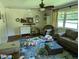 Living room with a couch and a ceiling fan at 2306 Cool Springs Rd, Sanford, NC 27330