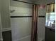 Shower tub with white tiled walls, a shower curtain, and a window at 2306 Cool Springs Rd, Sanford, NC 27330