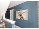 Upstairs hallway with unique artwork, decorative wall texture, and plenty of natural light at 2407 Cattail Pond Dr, Zebulon, NC 27597