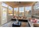 Relaxing sunroom with comfortable seating, string lights, and an outdoor view at 2407 Cattail Pond Dr, Zebulon, NC 27597