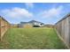 Spacious fenced backyard offering privacy and ample room for recreation, RV parking, and outdoor enjoyment at 25 Harlow Ct, Fuquay Varina, NC 27526