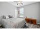 Serene bedroom with a large window, ceiling fan, and cozy decor at 25 Harlow Ct, Fuquay Varina, NC 27526