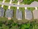 An aerial view of the back of homes, with patios and wooded areas at 2511 Range Overlook Xing, Apex, NC 27523