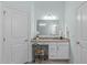Bathroom featuring a vanity with granite countertop, makeup counter, and soft lighting at 2511 Range Overlook Xing, Apex, NC 27523