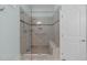 Accessible bathroom features a glass-enclosed shower with bench and grab bars at 2511 Range Overlook Xing, Apex, NC 27523