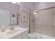 Bright bathroom featuring a glass-enclosed shower, a white vanity, and modern fixtures at 2511 Range Overlook Xing, Apex, NC 27523