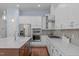 Kitchen featuring stainless steel appliances, white cabinets, and a center island with seating at 2511 Range Overlook Xing, Apex, NC 27523