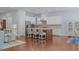 Bright kitchen featuring white cabinetry, stainless steel appliances, and an island with seating at 2511 Range Overlook Xing, Apex, NC 27523