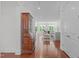 Spacious area with hardwood flooring and nice decor leading into the living room area at 2511 Range Overlook Xing, Apex, NC 27523