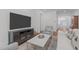 Bright living room featuring a large TV, comfortable seating, and stylish marble top coffee table at 2511 Range Overlook Xing, Apex, NC 27523