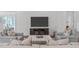 Cozy living room featuring stylish seating, hardwood flooring, and a flat screen television at 2511 Range Overlook Xing, Apex, NC 27523