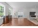 Open living space with abundant natural light, hardwood floors, and comfortable seating arrangement at 2511 Range Overlook Xing, Apex, NC 27523