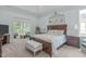 Serene main bedroom boasts a tray ceiling, deck access, and a calming color palette at 2511 Range Overlook Xing, Apex, NC 27523