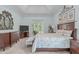 Serene main bedroom boasts a tray ceiling, deck access, and a calming color palette at 2511 Range Overlook Xing, Apex, NC 27523