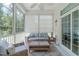 Cozy screened porch with comfortable seating, a ceiling fan, and serene outdoor views at 2511 Range Overlook Xing, Apex, NC 27523