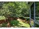 The backyard offers lots of trees and a wood fence to provide great privacy at 2613 Sweet Gum Dr, Hillsborough, NC 27278