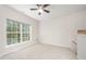 Carpeted bedroom with ceiling fan and bright window at 2613 Sweet Gum Dr, Hillsborough, NC 27278