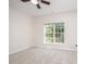 Cozy bedroom with carpet, ceiling fan and a bright window offering natural light at 2613 Sweet Gum Dr, Hillsborough, NC 27278