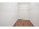 Walk-in closet with wire shelving and laminate flooring at 2613 Sweet Gum Dr, Hillsborough, NC 27278