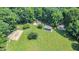 Aerial view of the community park including playground, picnic shelter, and a baseball field at 2613 Sweet Gum Dr, Hillsborough, NC 27278