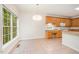Eat-in kitchen area with desk, bright light and view to backyard through large window at 2613 Sweet Gum Dr, Hillsborough, NC 27278