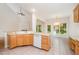 Open kitchen with breakfast bar, tile floors and eat in area with many windows at 2613 Sweet Gum Dr, Hillsborough, NC 27278