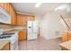 Modern kitchen with light wood cabinets, stainless steel appliances, and tile flooring at 2613 Sweet Gum Dr, Hillsborough, NC 27278