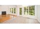 Bright living room with fireplace and hardwood floors open to the dining area at 2613 Sweet Gum Dr, Hillsborough, NC 27278
